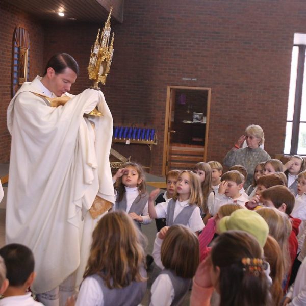 In Ellicott City, children gather for adoration