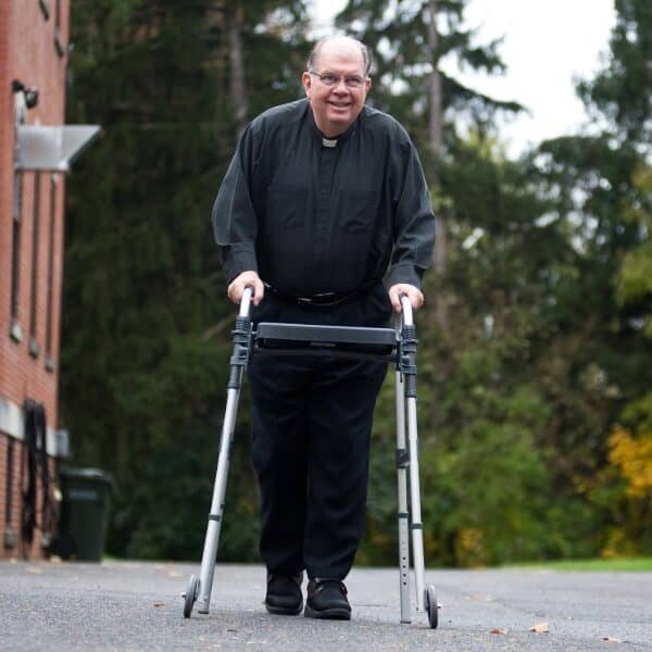 Miracle man? Paralyzed priest, former Annapolis pastor, begins walking