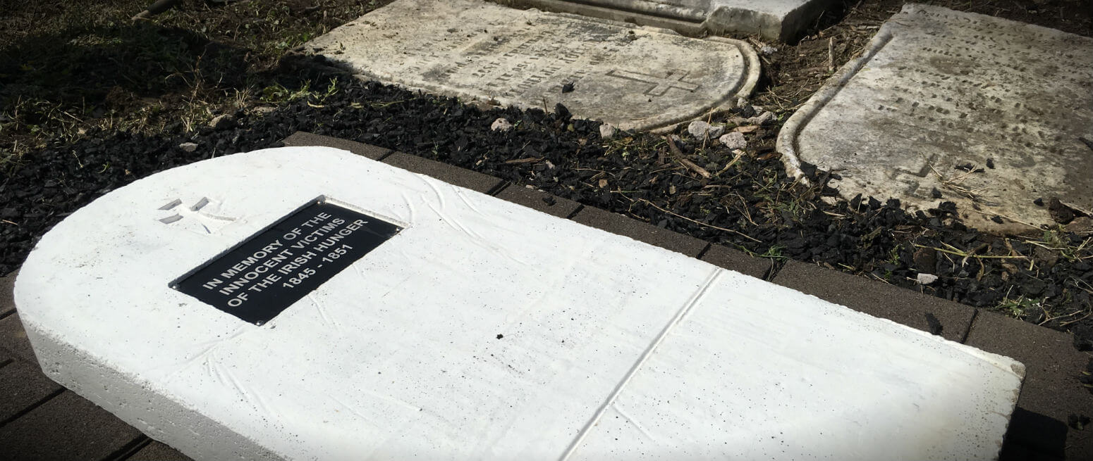 Volunteers help beautify cemetery, install memorial to victims of Great Irish Famine