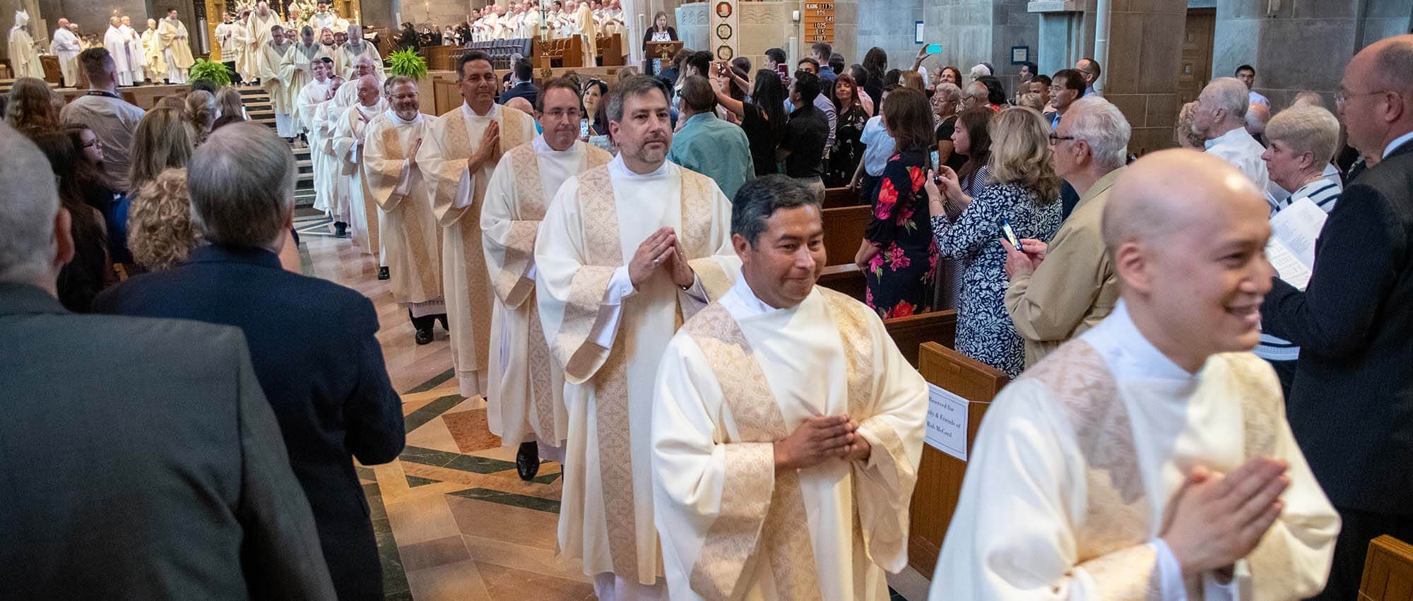 In family affair with Spanish accent, Baltimore Archdiocese ordains 14 permanent deacons