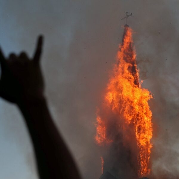 Demonstrators burn two churches in Chile on anniversary of protests