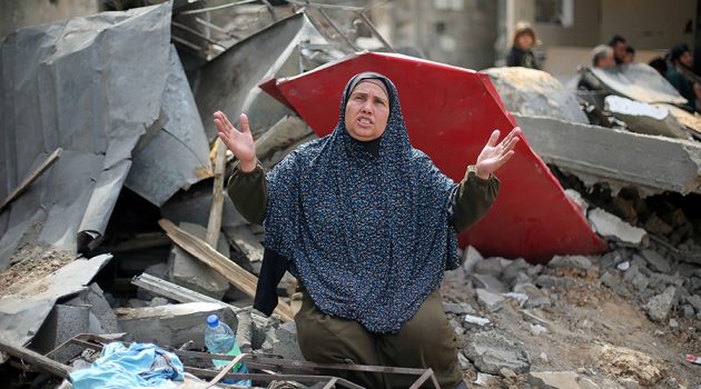 A Palestinian woman reacts after returning to her destroyed house in Gaza.