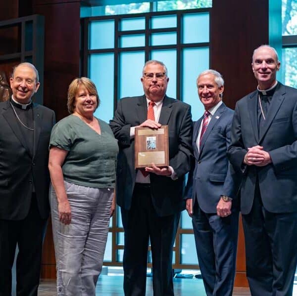 During schools convocation, Tom Alban and Robert Redfield awarded archdiocese’s highest education honor