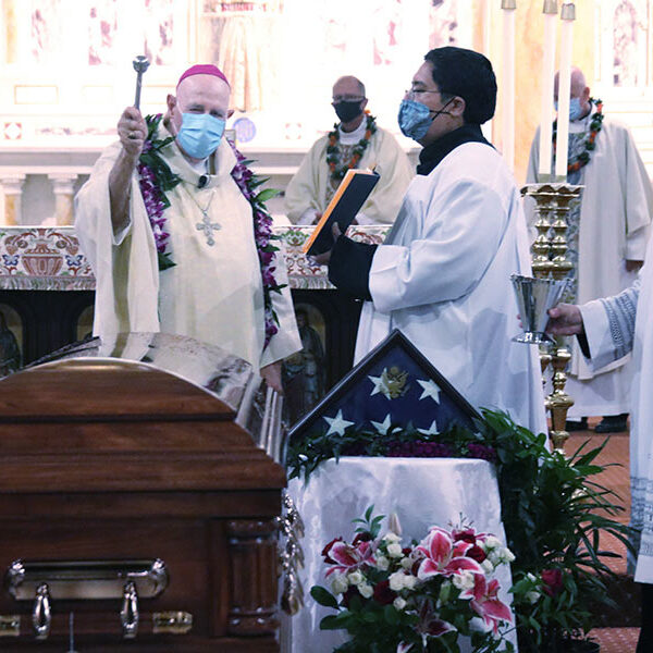 Hawaii Mass is send-off for remains of war-hero priest to return to Kansas