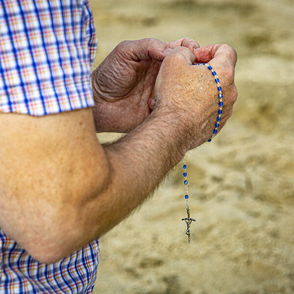 Rally participants gather near U.S. Capitol to pray rosary for the nation