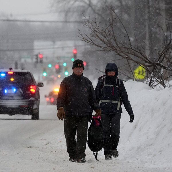 Priest weathers Christmas blizzard on fireboat celebrating Mass for two