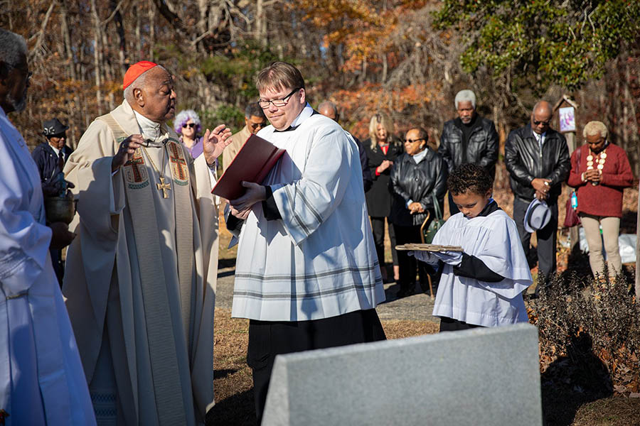 Cardinal Gregory blesses parish cemetery marker honoring enslaved