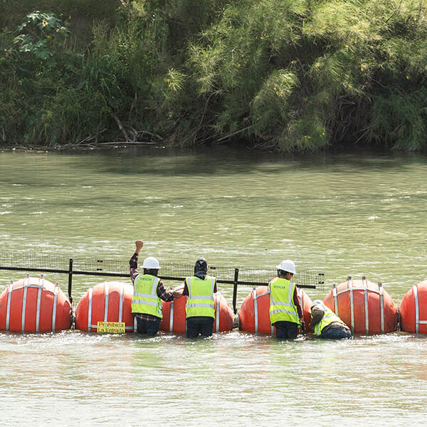 Biden administration sues Texas over anti-migrant buoys in the Rio Grande