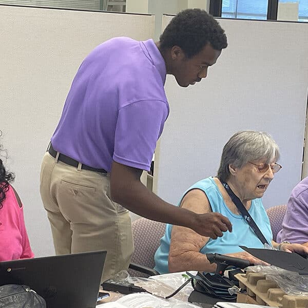 Calvert Hall students help seniors navigate new technology