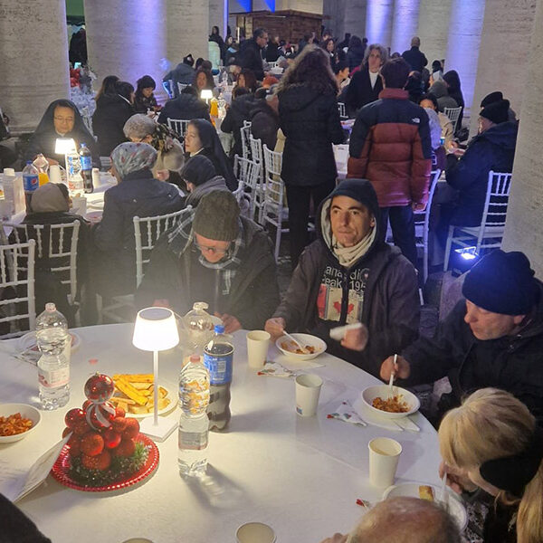 Special guests at dinner under Bernini’s colonnade — the homeless