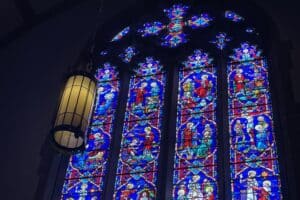 stained glass window showing scenes of Jesus' life