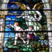 Stained glass window shows guardian angel with boy and girl