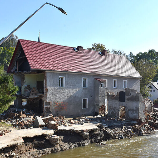 Amid dramatic scenes of floods sweeping through entire villages, Polish Catholics rush to help