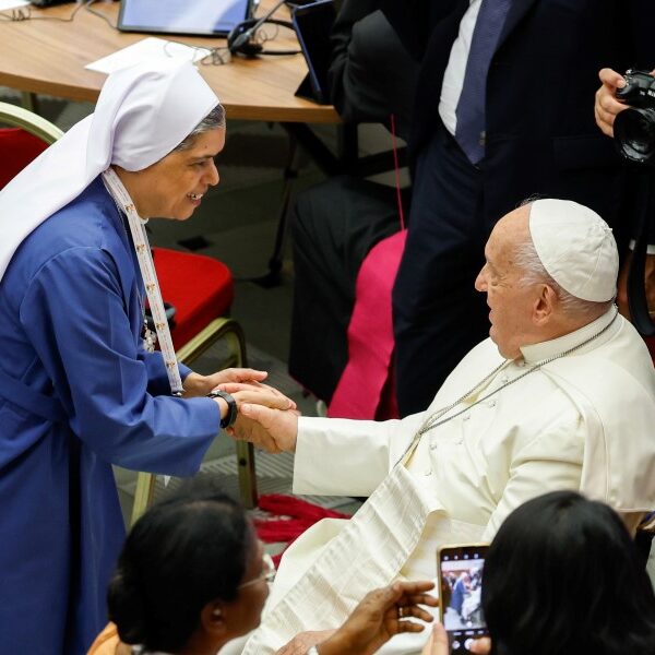 Pope defends decision to give women, laymen voting rights at synod