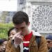 Man praying at notre dame