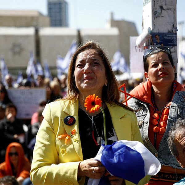 Tens of thousands of Israelis line streets for funeral procession for Bibas family