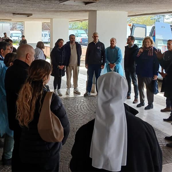 As Pope Francis leaves hospital, his almoner and doctors bring medical care to migrants