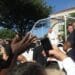 Pope Francis rides by a crowd outside Catholic University in 2015