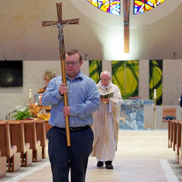 With reverence, contagious smile, volunteer with Down syndrome inspires Michigan parish