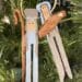 Clothespin ornaments depicting Joseph, Mary, and Baby Jesus hang on a Christmas tree