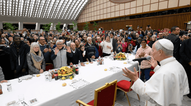 Pope Leo XIV welcomes his guests and blesses the meal at a luncheon