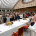 Pope Leo XIV welcomes his guests and blesses the meal at a luncheon