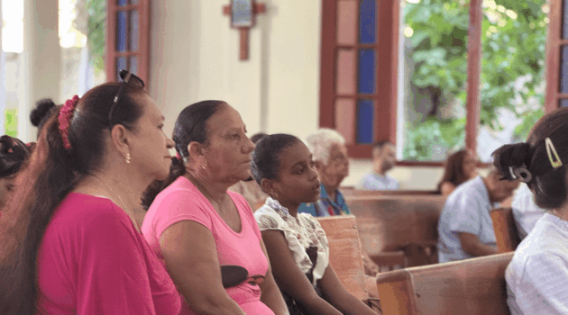 Churchgoers listen during Mass