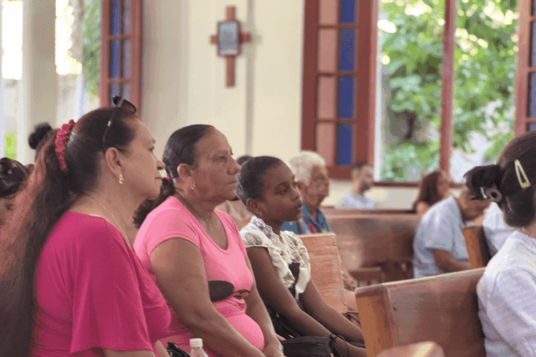 Churchgoers listen during Mass