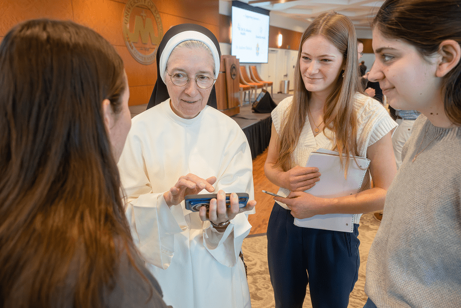 Sister Mary Diana Drager chats with students