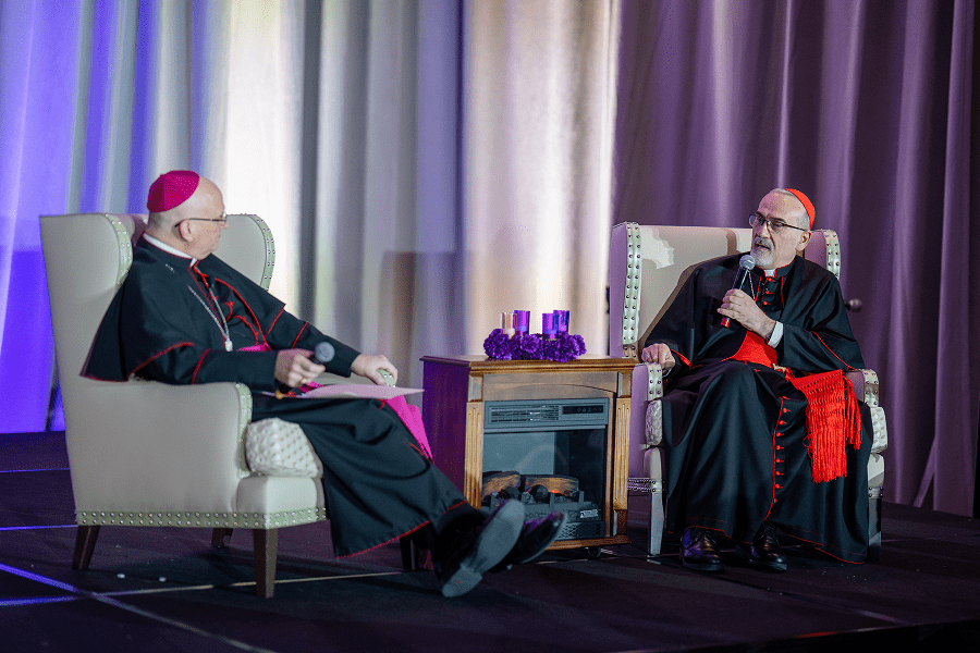 Detroit Archbishop Edward J. Weisenburger and Cardinal Pierbattista Pizzaballa, Latin patriarch of Jerusalem, engage in conversation