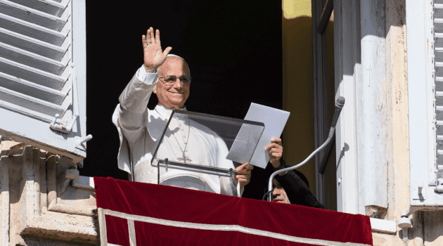 Pope Leo XIV waves to visitors gathered in St. Peter's Square