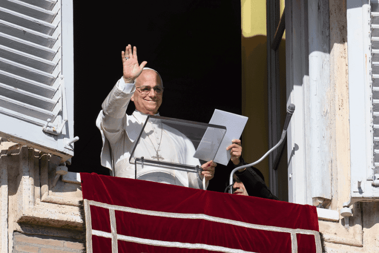 Pope Leo XIV waves to visitors gathered in St. Peter's Square