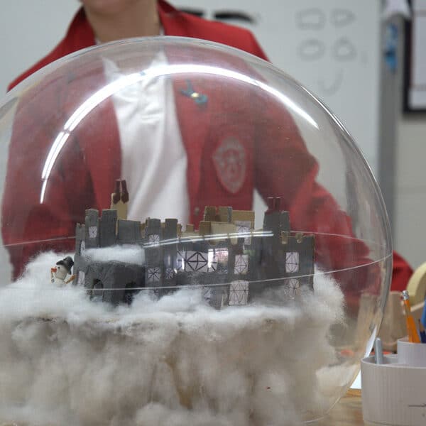 Local schools decorate snow globes for charity