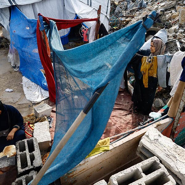 Israel bans dozens of aid groups from Gaza, including Caritas, drawing condemnation