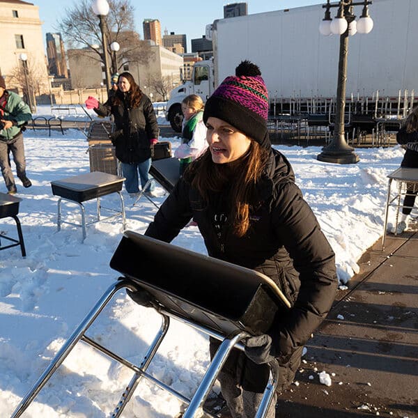 Empty school desks on Minnesota Capitol grounds signify children lost to gun violence