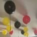 Red, yellow, and black balloons at the ceiling