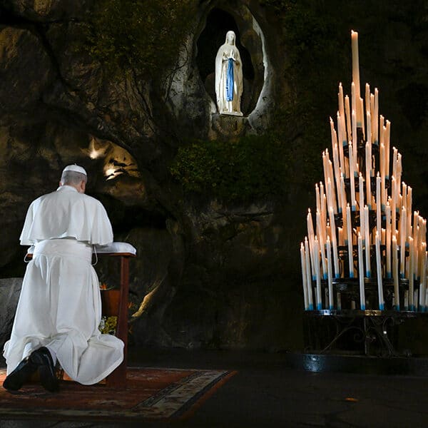 Pope Leo prays for the sick and suffering in the Lourdes grotto in France