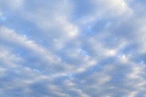 clouds dotting a blue sky
