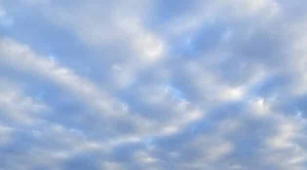 clouds dotting a blue sky