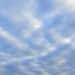 clouds dotting a blue sky