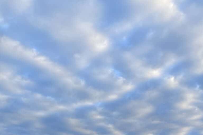 clouds dotting a blue sky