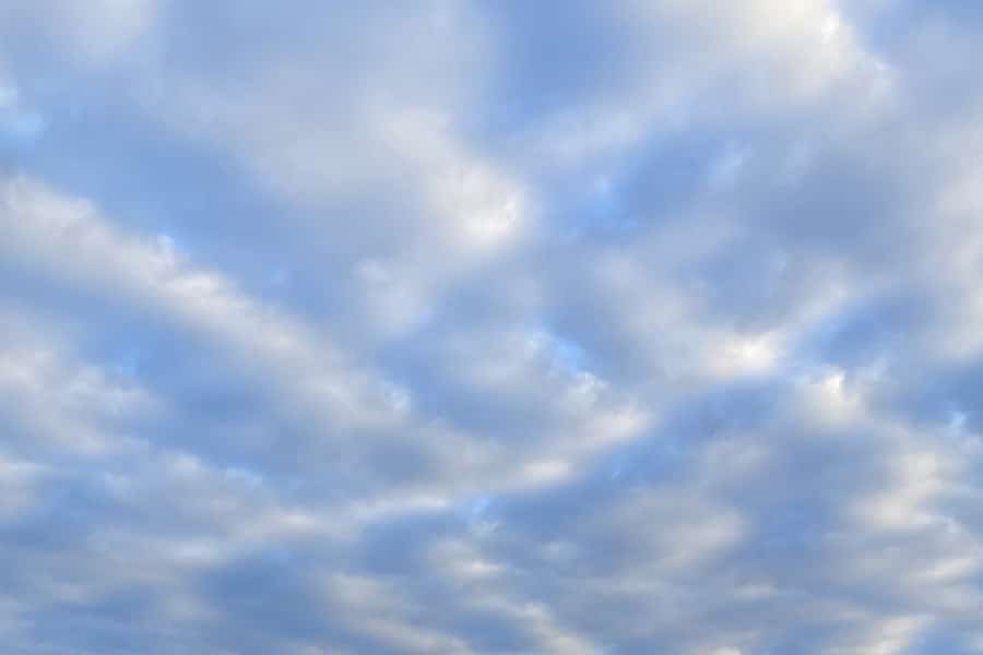 clouds dotting a blue sky