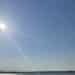 Rays come from the sun in a blue sky